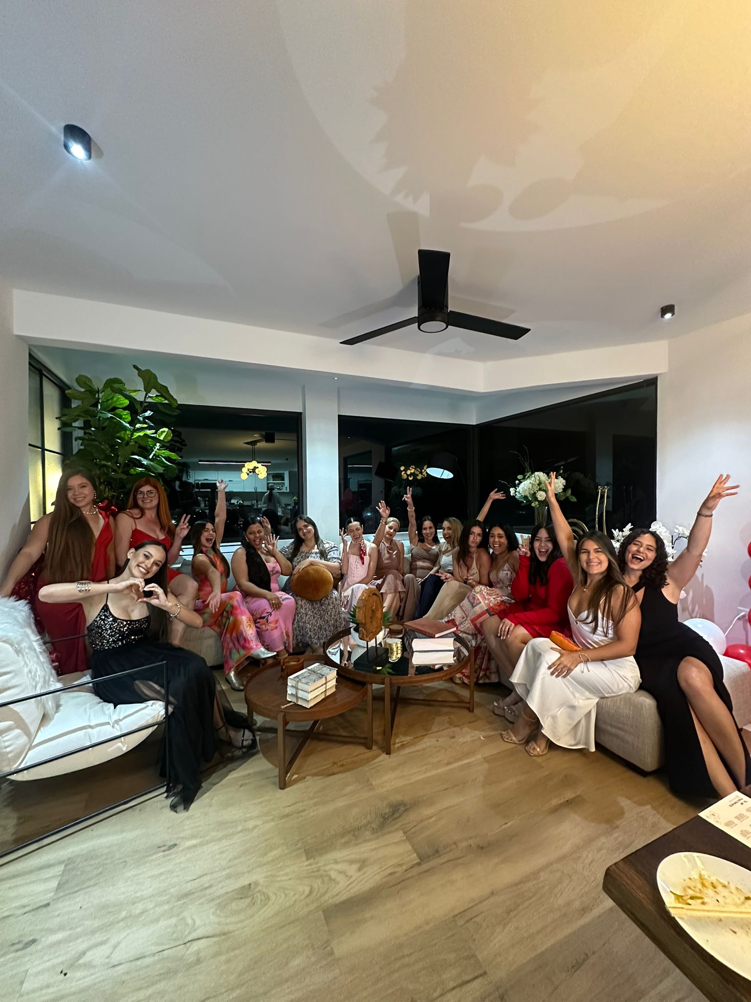 Friends and family celebrating a birthday together in the spacious living room at Blue Malibu PR in Camuy
