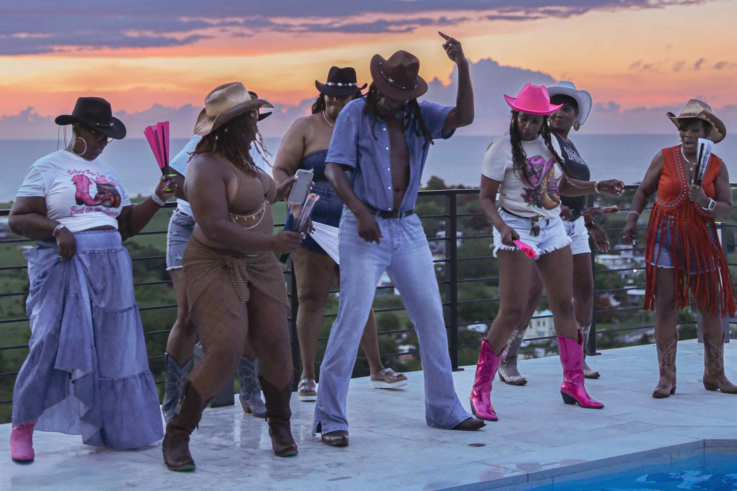 Guests dancing together at an outdoor celebration in Puerto Rico hosted by Blue Malibu PR