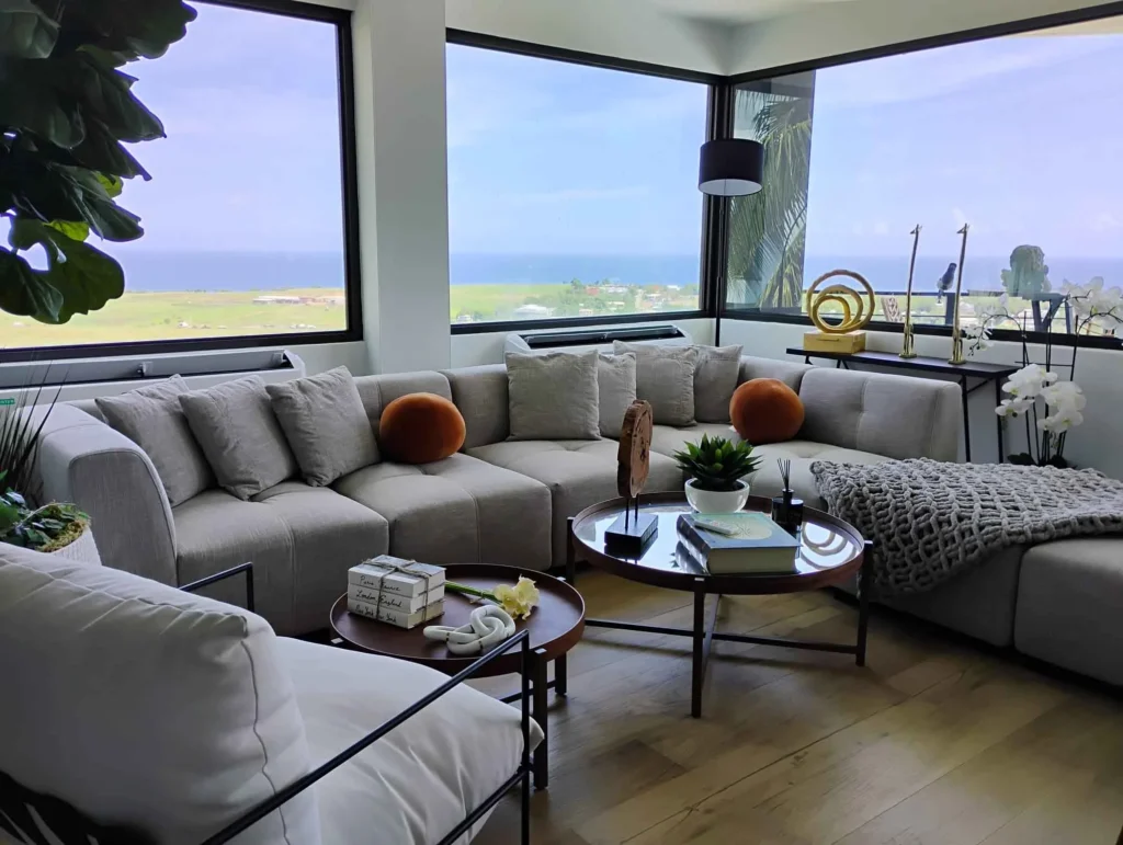 Spacious living room with sectional sofas and panoramic coastal views at Blue Malibu PR luxury villa in Puerto Rico