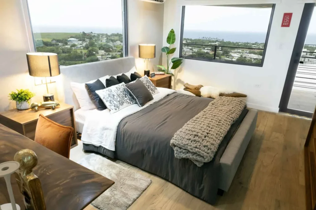 Spacious luxury bedroom at Blue Malibu PR in Camuy Puerto Rico with a king-size bed and panoramic coastal views